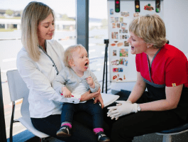 Baby and toddler dentist, dentist assessing baby